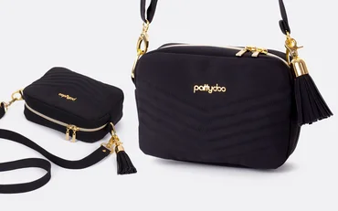 Schnittmuster Handtasche schwarzes Kunstleder Verzierung Quaste