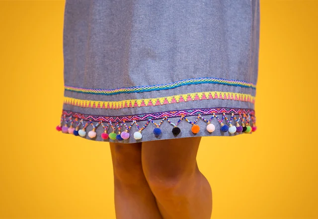 Schnittmuster Tunikakleid Rocksaum mit Bommeln Verzierung