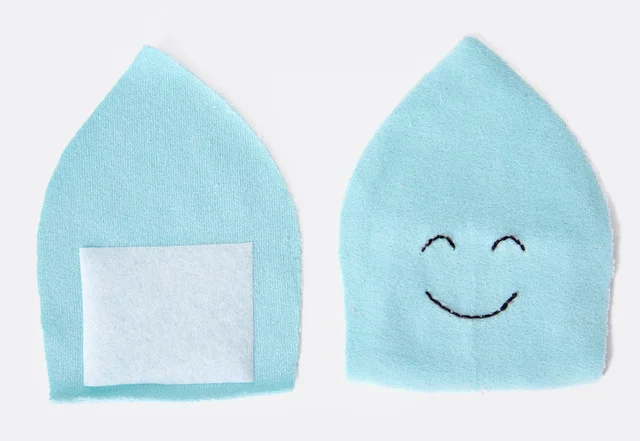 Wende-Krake: Gesicht auf Schnittteil aufsticken