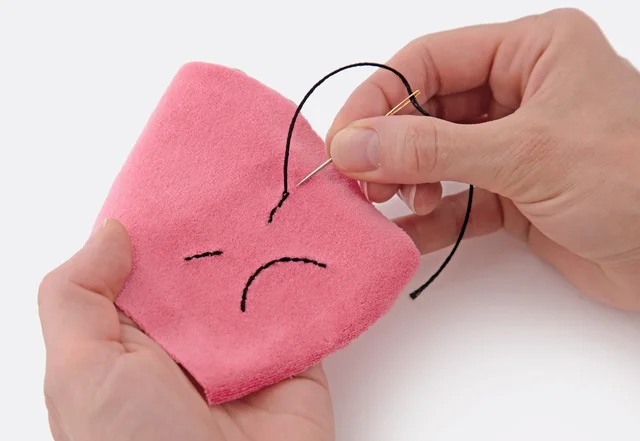 Oktopus Kuscheltier: Gesicht auf Schnittteil aufsticken