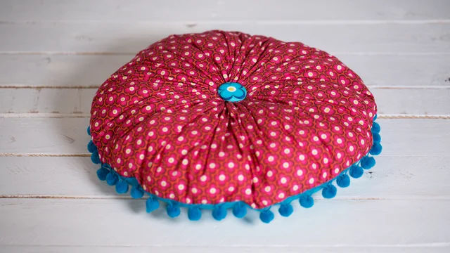 Nähanleitung rundes Kissen mit Bommelborte