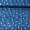 Weihnachtspopeline Karo Bäume Royalblau Gold