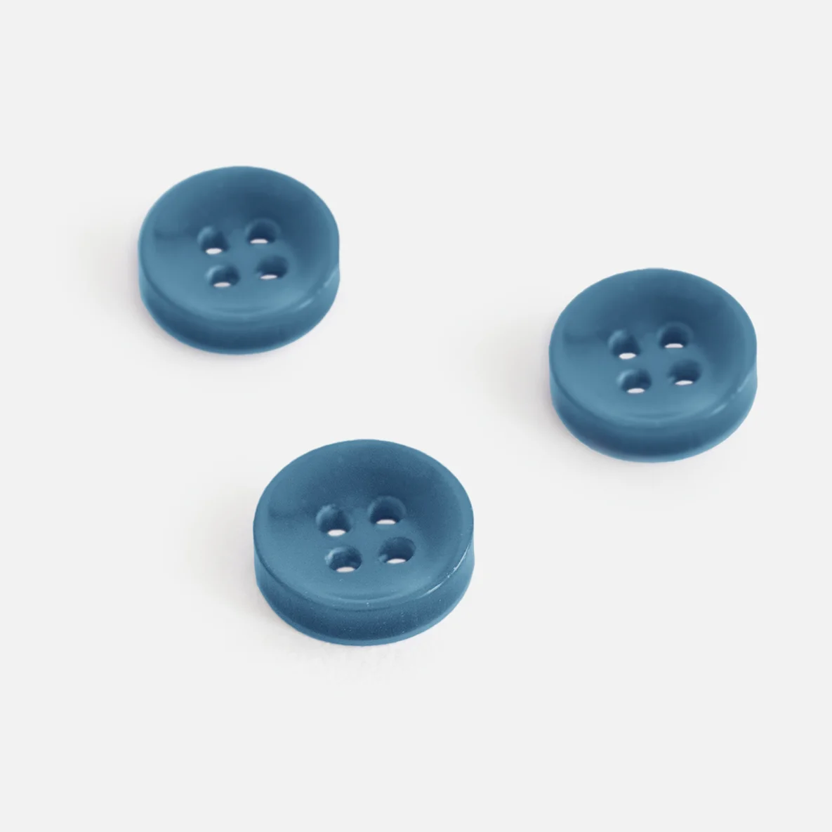 Knopf Perlmutt-Optik Petrol